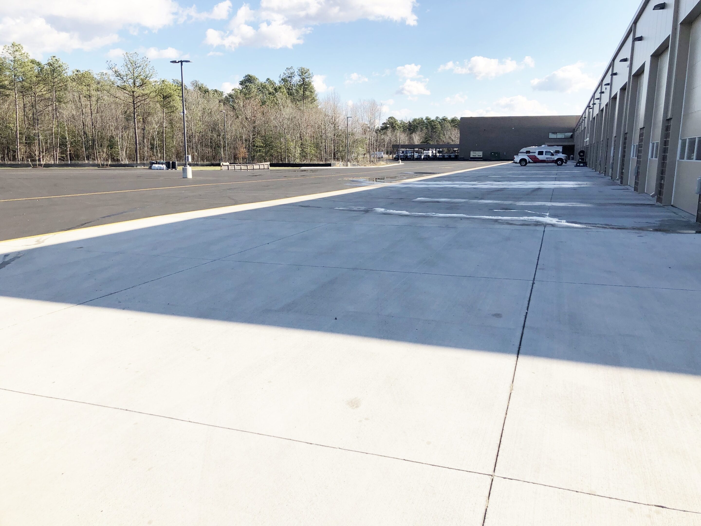 A parking lot with cars parked on the side of it.