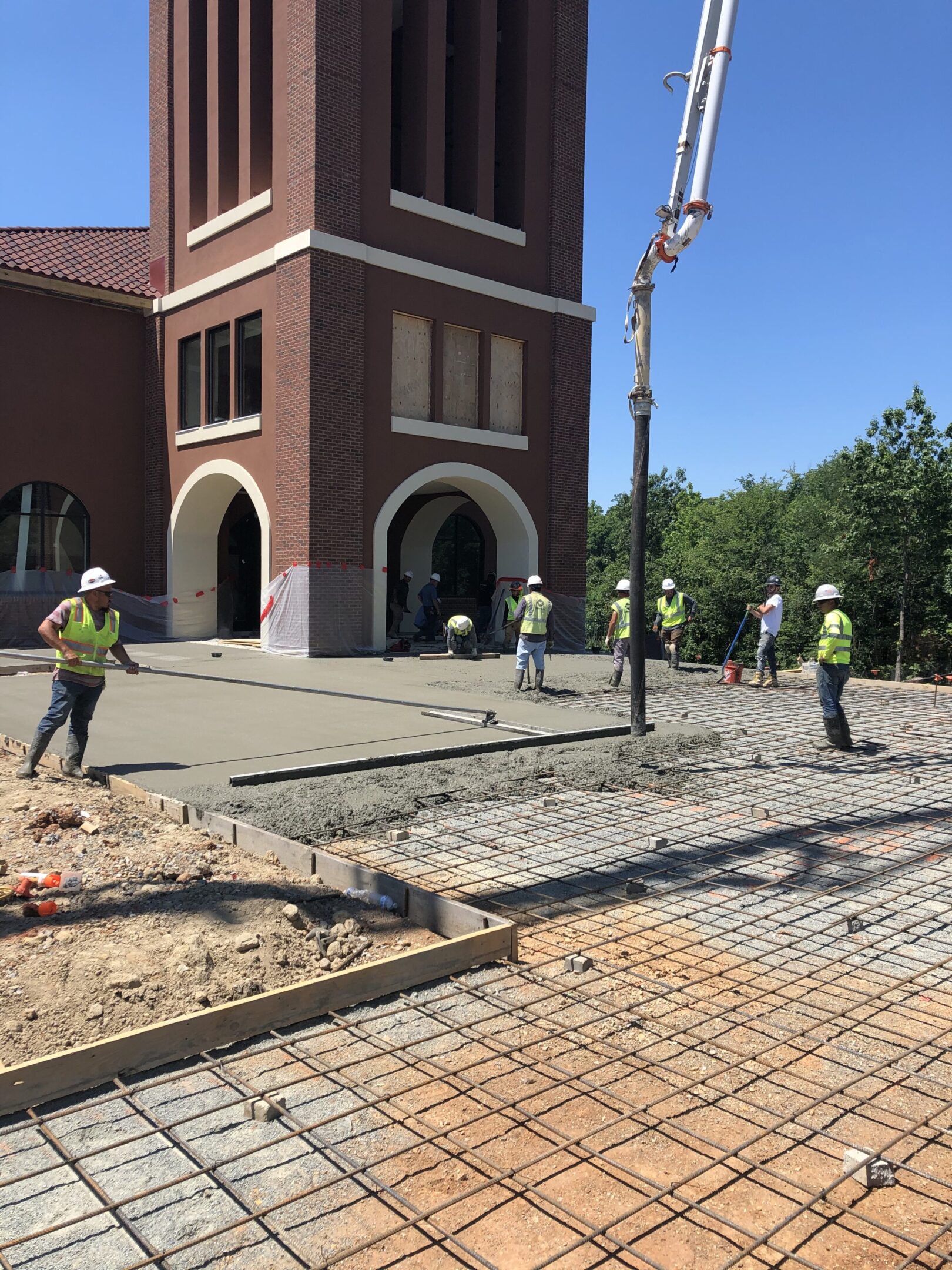 A group of men working on the sidewalk.