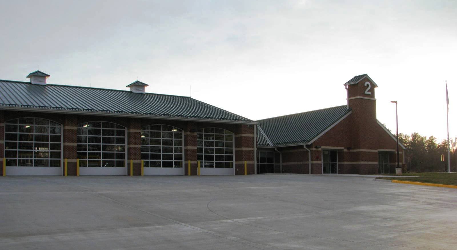 A large building with two fire stations in it.