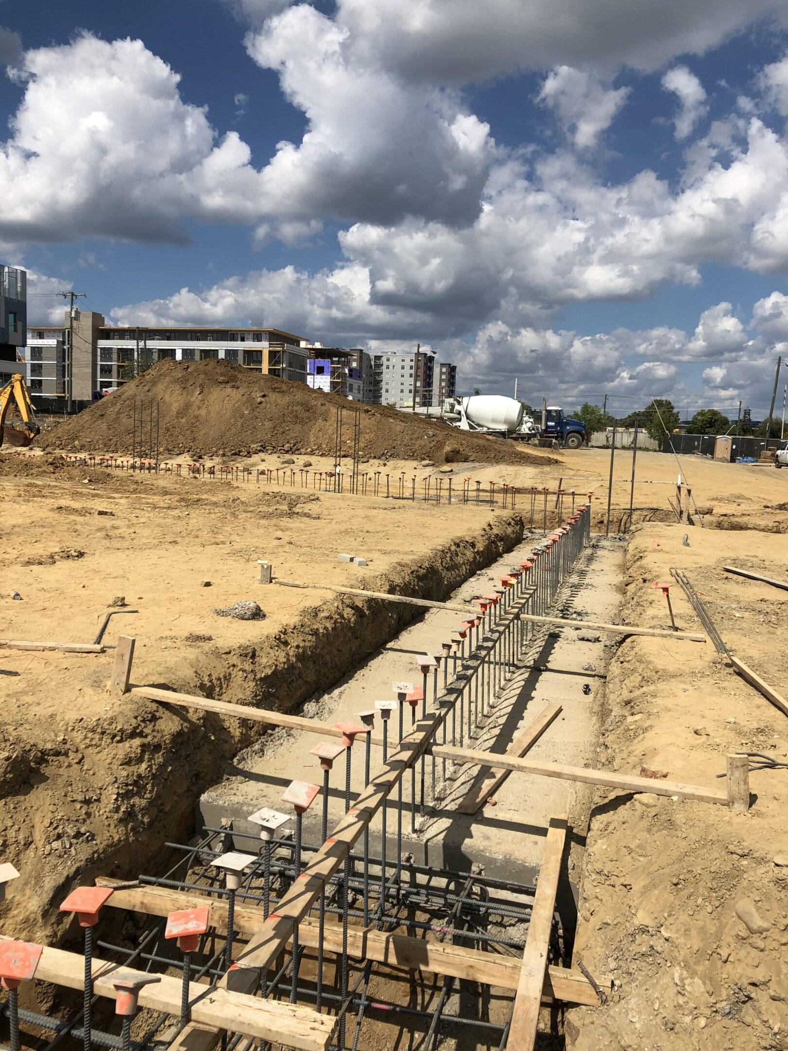 A construction site with many pipes and concrete