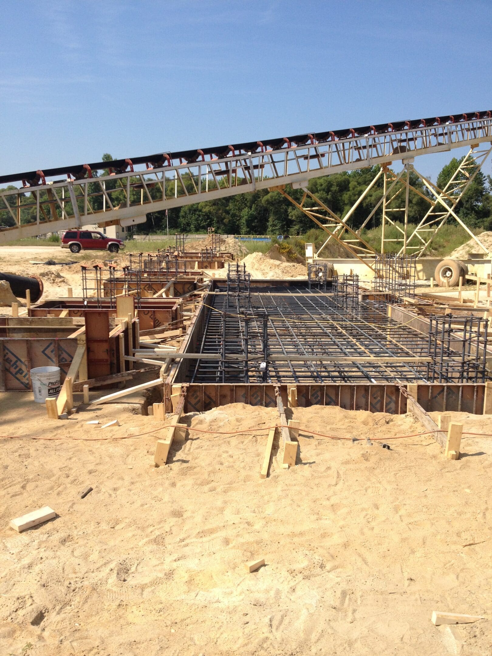 A construction site with a large metal structure.