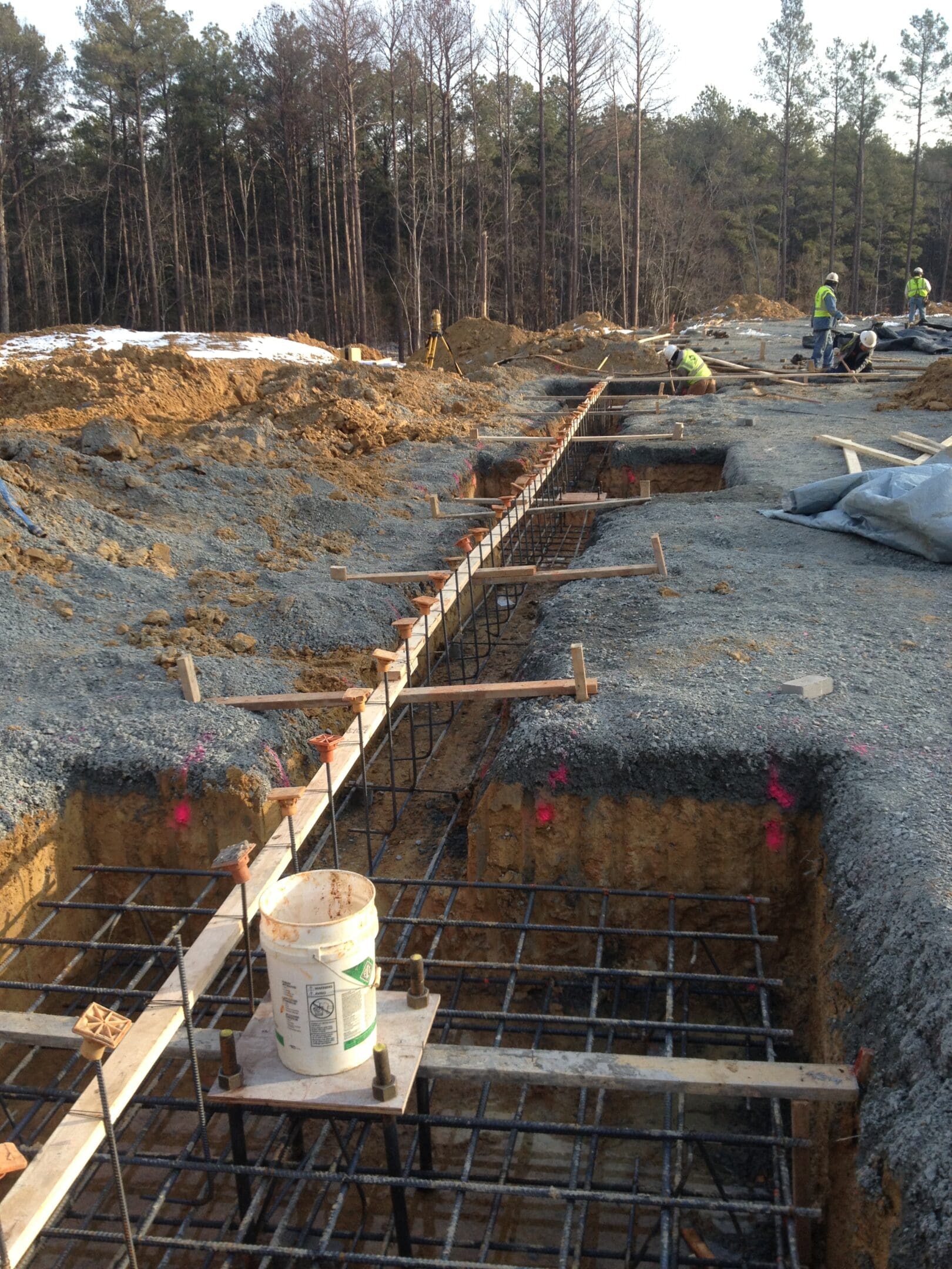 A group of workers are working on the ground.