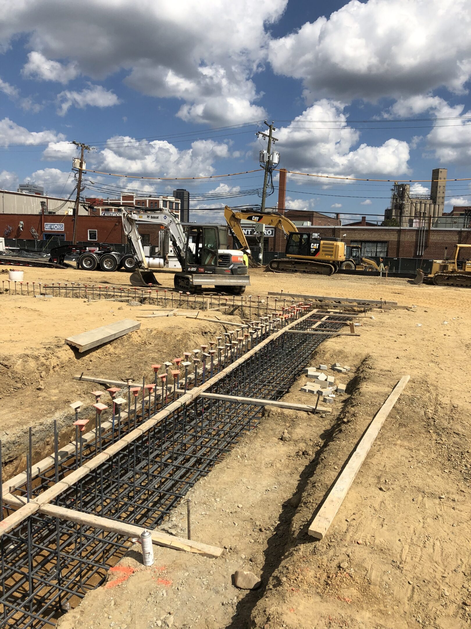 A construction site with a large amount of dirt.