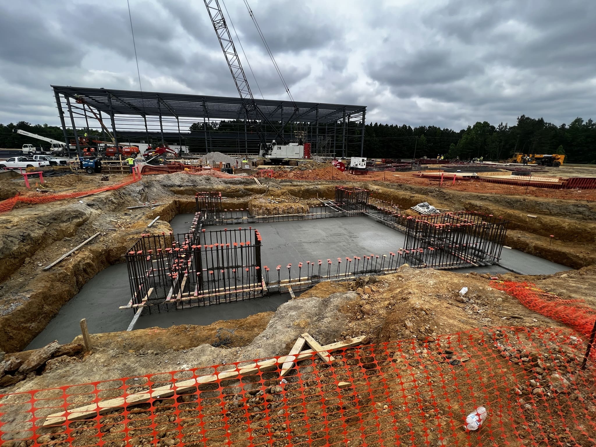 A construction site with lots of dirt and concrete.