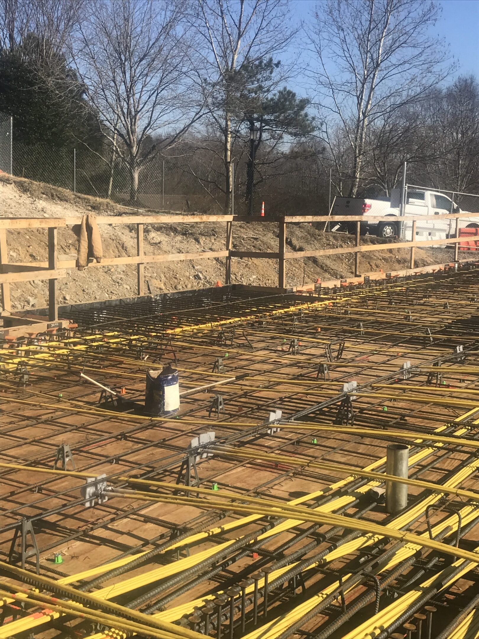 A view of a construction site with yellow pipes.