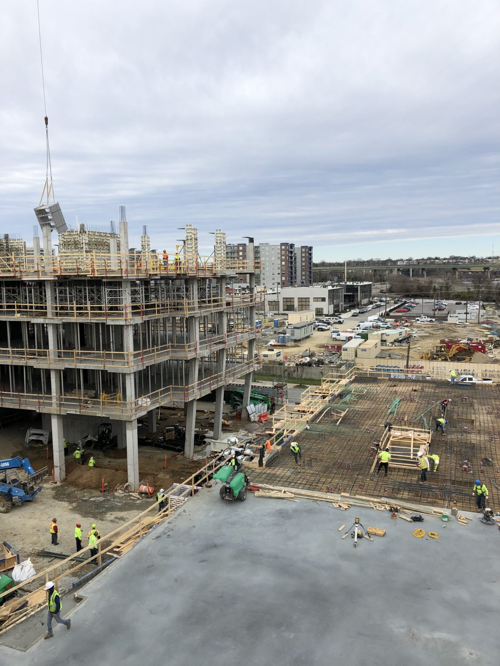 A construction site with many workers on it.