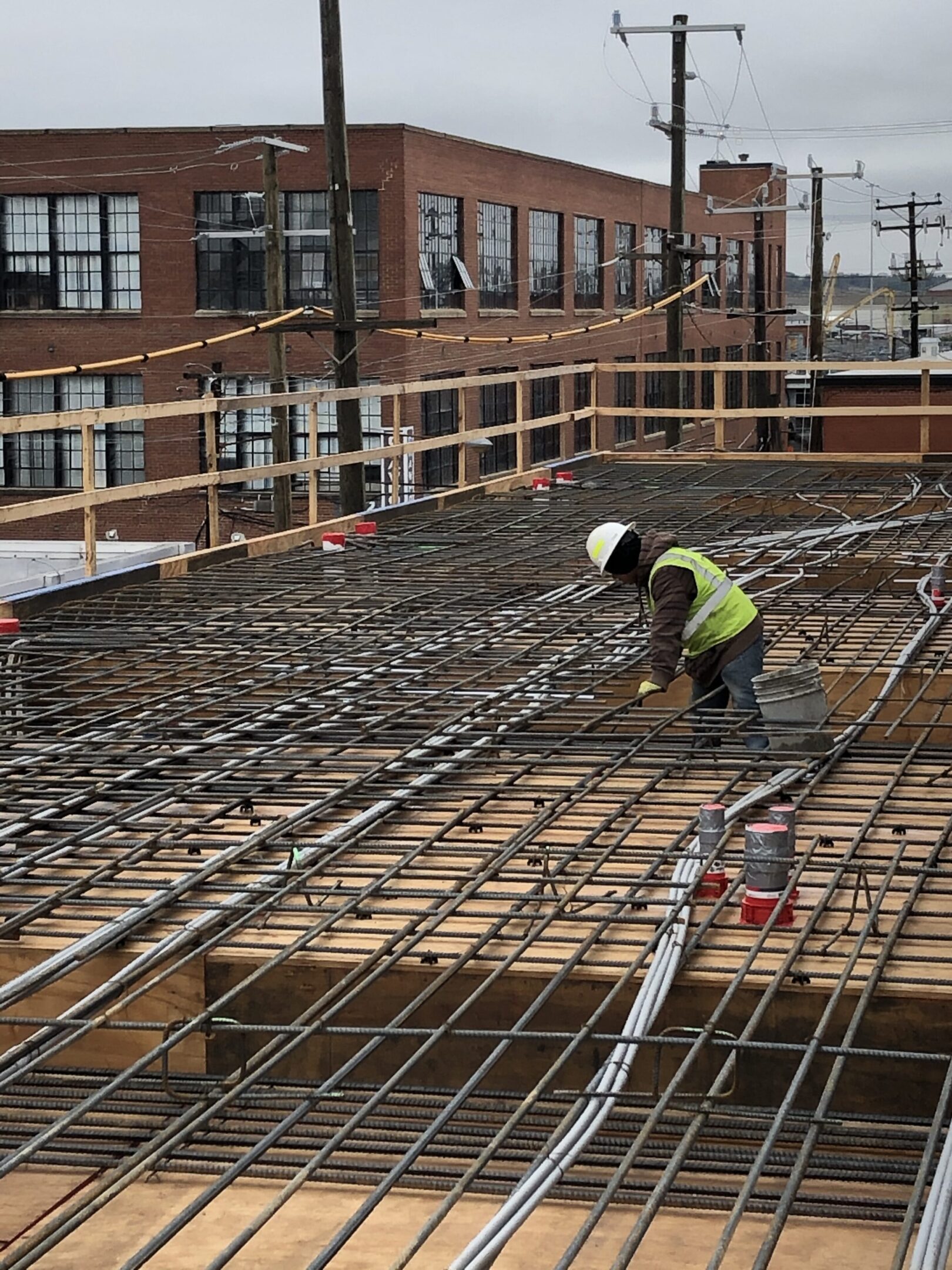 A construction worker is working on the ground.