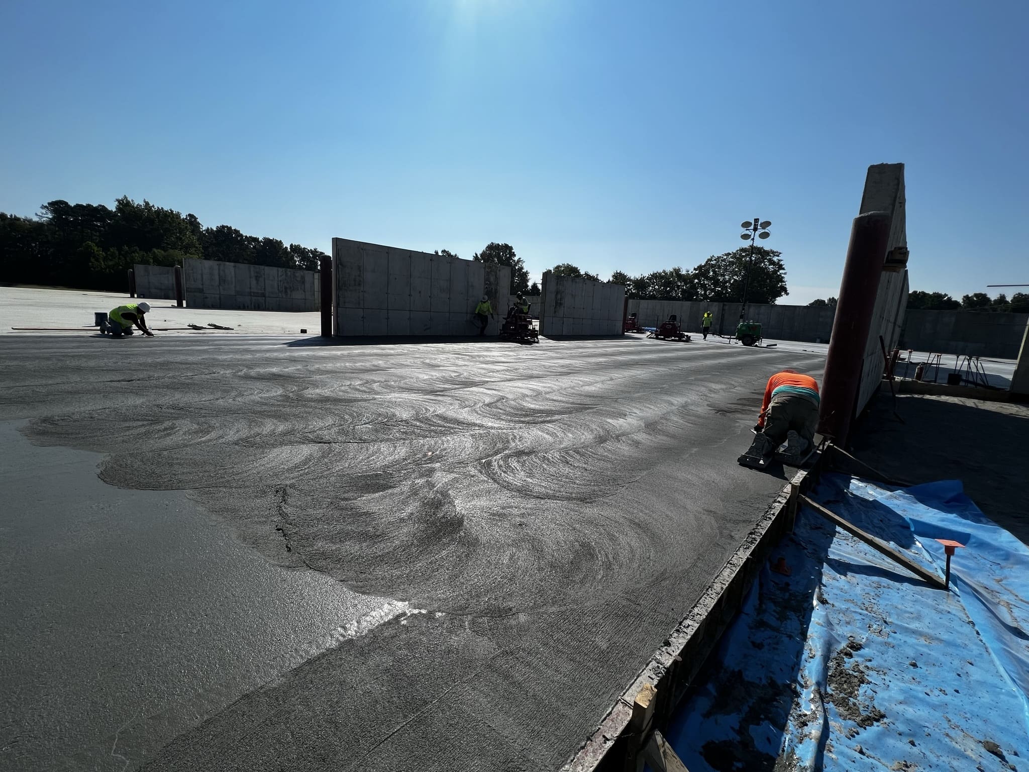 A large empty lot with some trucks parked in it