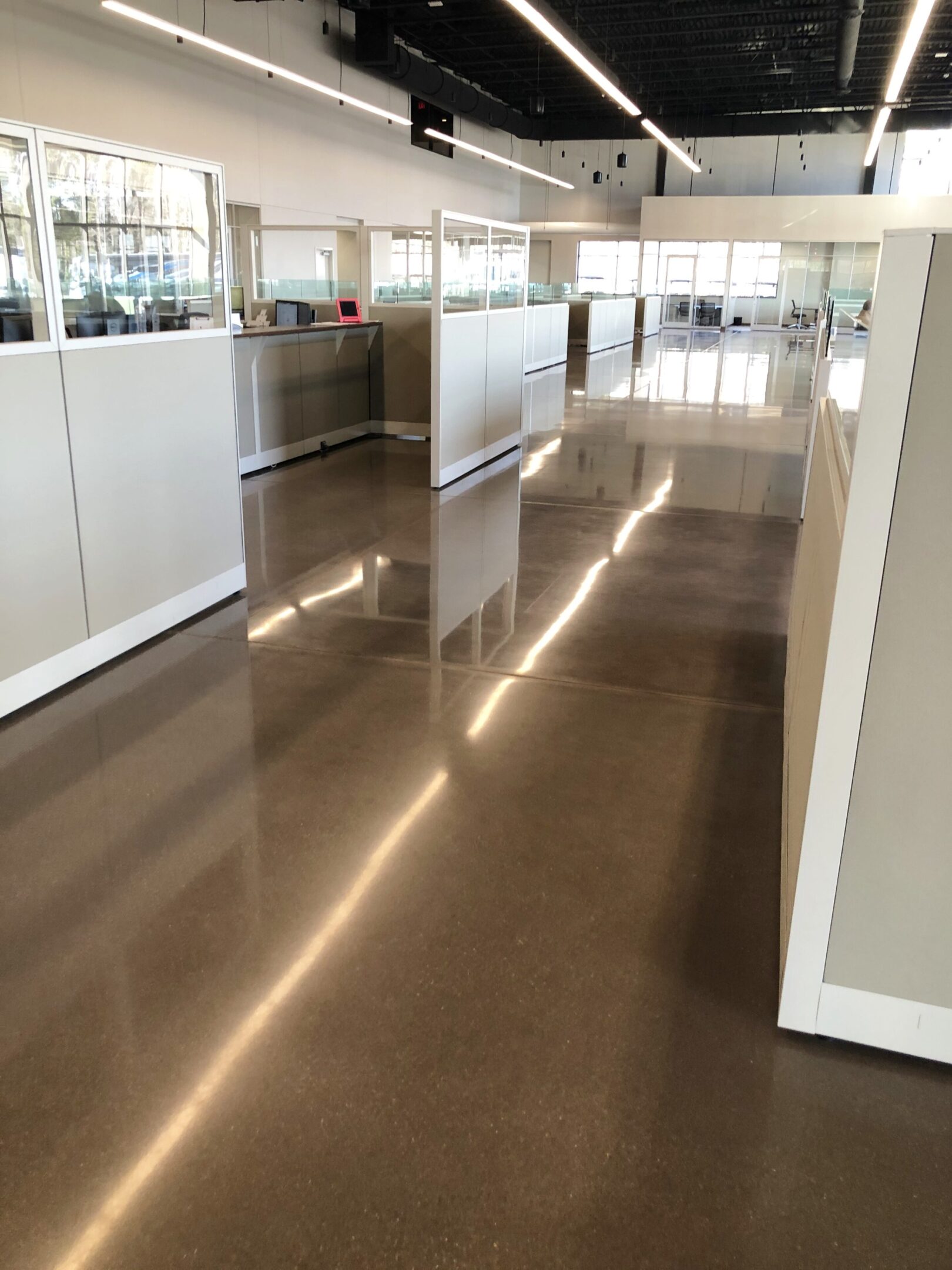 A large room with shiny floors and white walls.