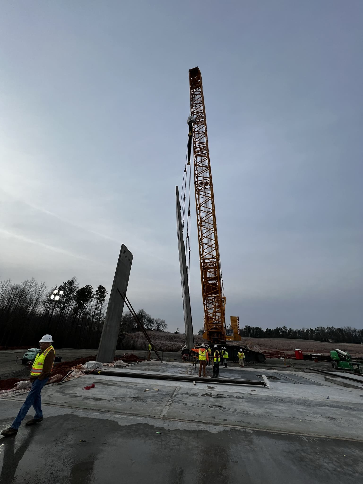 A crane is being used to lift concrete.