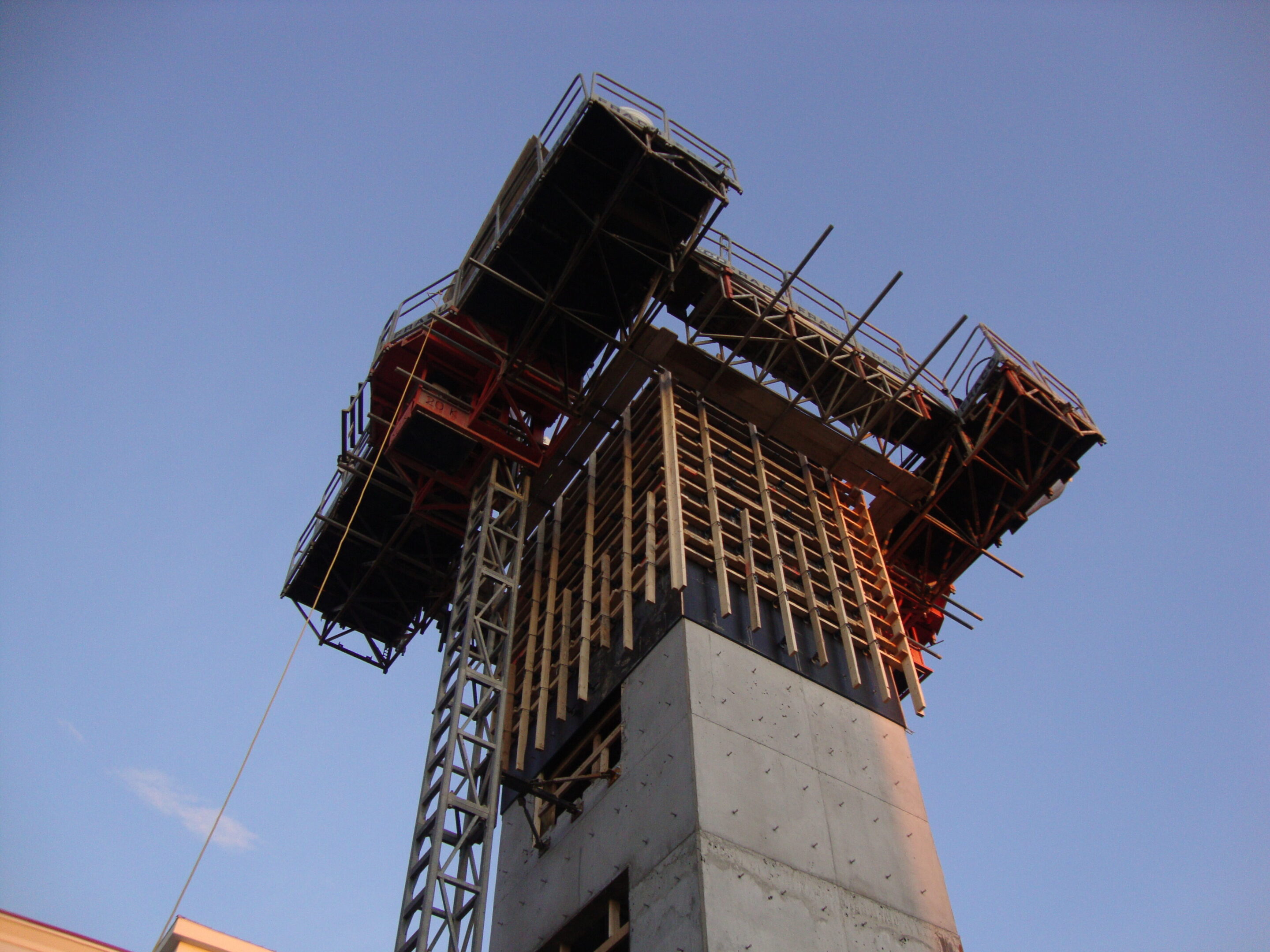 A tall building with scaffolding on it's side.