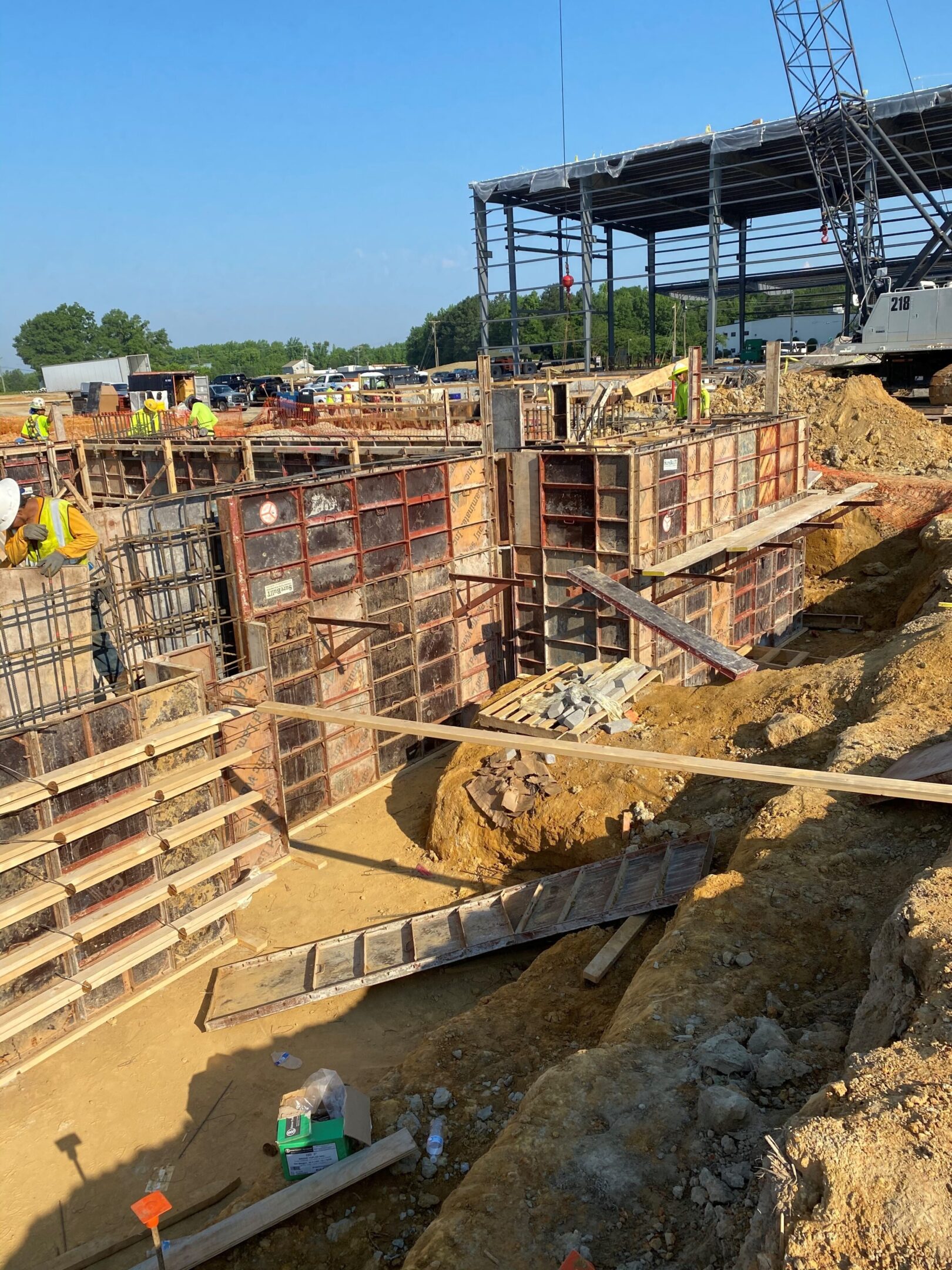 A construction site with many piles of concrete.